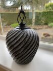 Hand carved hollow form with a spiral finial