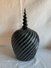 Hand carved hollow form with a spiral finial